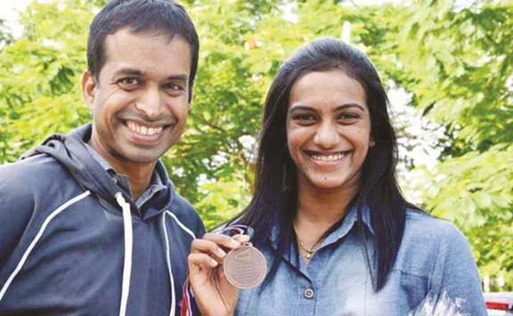 Pullela Gopichand (left) with Olympic medallist PV Sindhu.