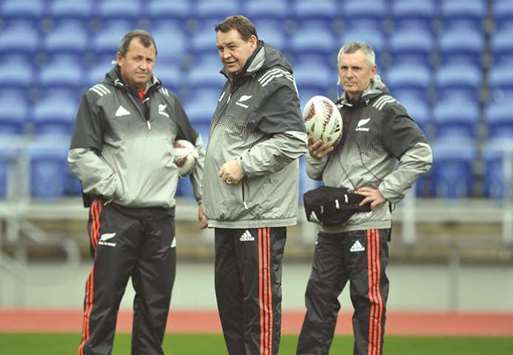 New Zealand All Blacks head coach Steve Hansen (centre), assistant head coach Ian Forster (left) and selector Grant Fox watch their players take part in a training session in Auckland yesterday. (AFP)