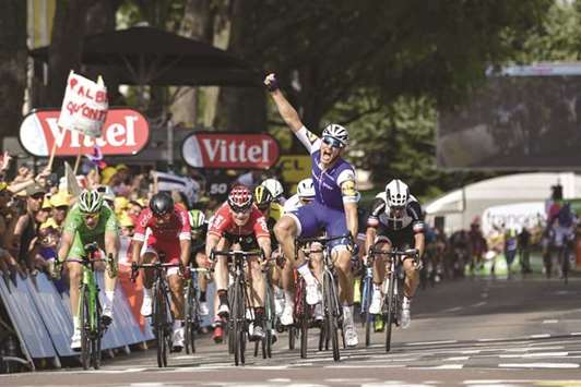 Germanyu2019s Marcel Kittel (second from right) celebrates as he crosses the finish line to win the sixth stage of the Tour de France in Troyes, France, yesterday. (AFP)