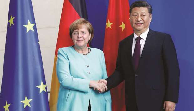 German Chancellor Angela Merkel and Chinese President Xi Jinping shake hands after a news conference in Berlin. Airbus secured an outline deal from China for 100 A320-series jets split between current and new-engine-option versions, as well as 40 of its latest twin-aisle A350s, chief executive officer Tom Enders said on Wednesday in Berlin during a visit to the German capital by Chinese President Xi Jinping.
