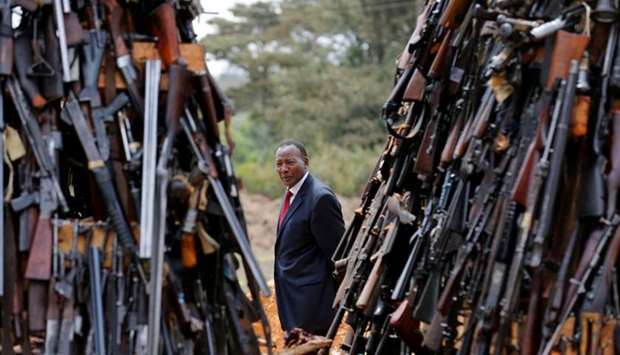 Kenya's Interior Cabinet Secretary Joseph Nkaissery inspects an assortment of guns during a public destruction of 5250 illicit firearms and small weapons, recovered during various security operations in Ngong hills near Kenya's capital Nairobi, File photo:  November 15, 2016