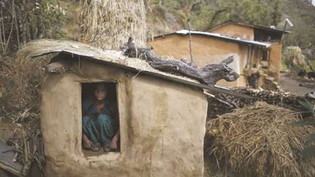 This file photo shows a girl staying in a hut built to house menstruating women.