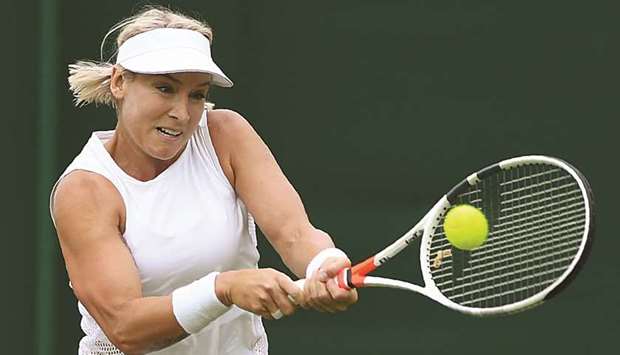 US player Bethanie Mattek-Sands returns against Polandu2019s Magda Linette during their womenu2019s singles first round match on the second day of Wimbledon.