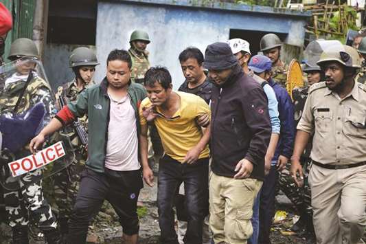 An injured man is taken away during clashes between Gorkhaland supporters and the police in Sonada near Darjeeling.