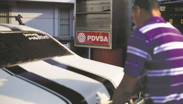 The corporate logo of PDVSA is seen at a gas station in Caracas. The state oil firm has proposed selling a 9% stake in the San Cristobal field to ONGC Videsh, a subsidiary of Indiau2019s state-owned top explorer Oil and Natural Gas Corp, sources said.
