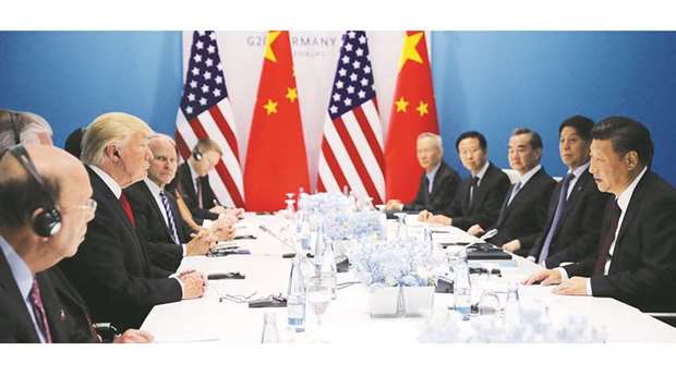 US President Donald Trump and Chinese President Xi Jinping attend the bilateral meeting at the G20 leaders summit in Hamburg. Xi took a swipe at the US for retreating from globalisation, exposing the tensions before a meeting of world leaders divided over everything from trade and climate change to handling North Koreau2019s provocations.