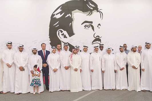 UDC officials in front of the mural at The Pearl-Qatar.