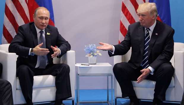 Russia's President Vladimir Putin talks to U.S. President Donald Trump during their bilateral meeting at the G20 summit in Hamburg, Germany July 7, 2017.