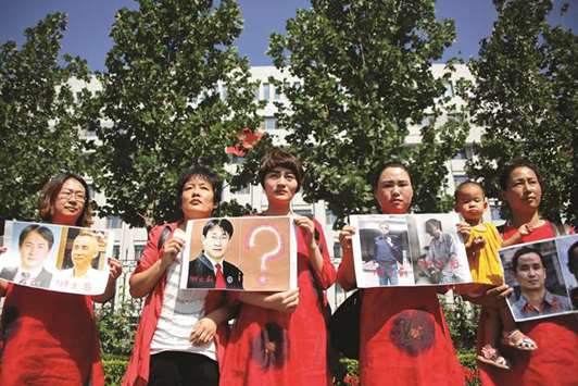 Relatives of those detained in what is known as the u201c709u201d crackdown protest in front of the Supreme Peopleu2019s Procuratorate in Beijing.