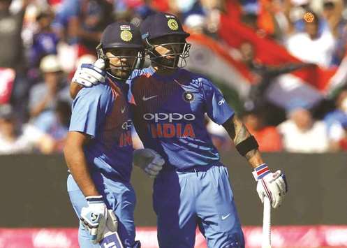 Indiau2019s Rohit Sharma (left) with Indiau2019s captain Virat Kohli during the third international Twenty20 match against England at The Brightside Ground, Bristol, on Sunday. (AFP)