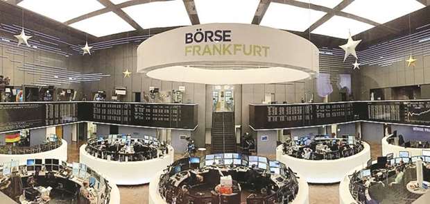 Traders at the Frankfurt Stock Exchange. The DAX 30 gained 0.5% to 12,609.85 points yesterday.