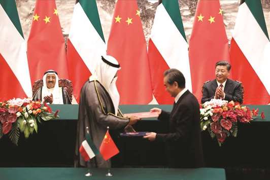 Kuwaitu2019s Amir Sheikh Sabah al-Ahmad al-Jaber al-Sabah (left) and Chinese President Xi Jinping (right) applaud as they witness a signing ceremony at the Great Hall of the People in Beijing. Beijing has ramped up engagement in the Middle East in recent years as Arab nations play an important role in Xiu2019s signature Belt and Road foreign policy plan for strong trade routes linking China with central and southeast Asia.