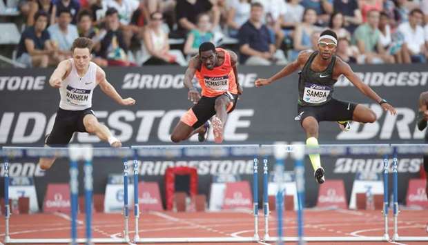 Qataru2019s Abderrahman Samba (R) leads British Virgin Islandsu2019 Kyron McMaster (C) and Norwayu2019s Karsten Warholm during the menu2019s 400 hurdles in the Paris Diamond League meeting yesterday.