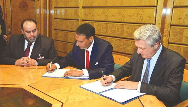 Officials signing the agreement in Geneva, Switzerland.