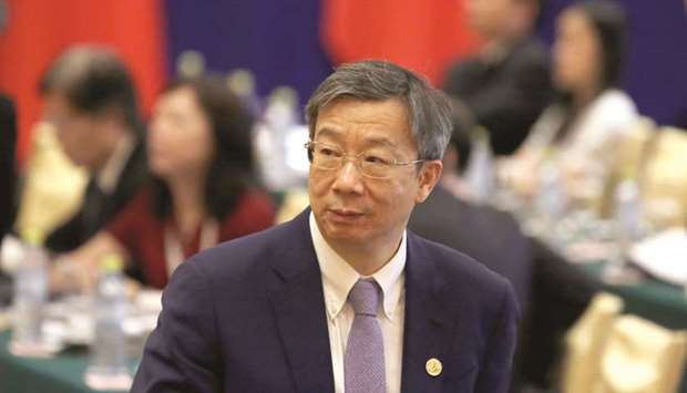 Chinau2019s central bank governor Yi Gang arrives for the EU-China High-level Economic Dialogue at Diaoyutai State Guesthouse in Beijing. The Peopleu2019s Bank of China will lower the reserve ratios for some banks as of next Thursday, the third cut this year, as it strives to keep a balance between debt control and stable growth.