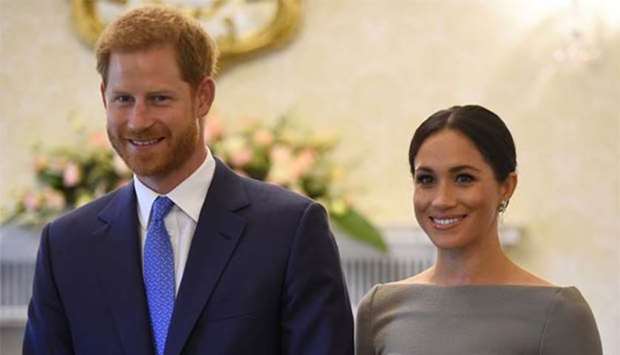 Prince Harry and his wife Meghan, Duchess of Sussex, smile in Dublin on Wednesday.