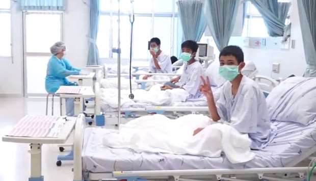 This handout video grab taken from footage released by The Thai government public relations department (PRD) and Government spokesman bureau shows the boys rescued from the cave being treated at a hospital in Chiang Rai.
