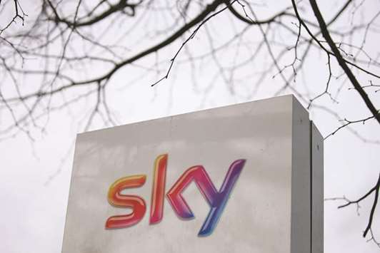 A logo is pictured on a sign next to the entrance to pay-TV giant Skyu2019s headquarters in Isleworth, London. Rupert Murdochu2019s 21st Century Fox has raised its offer for Sky in an agreed deal valuing the pay-TV group at $32.5bn, seeing off rival bidder Comcast for now.