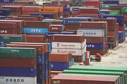 Shipping containers are seen at a port in Shanghai. China accused the United States of bullying and warned it would hit back after the Trump administration raised the stakes in their trade dispute, threatening 10% tariffs on $200bn of Chinese goods.