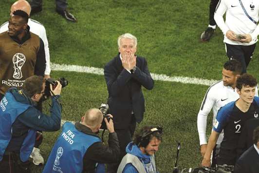 Franceu2019s coach Didier Deschamps blows kisses as he celebrates at the end of the Russia 2018 World Cup semi-final against Belgium in Saint Petersburg on Tuesday. (AFP)