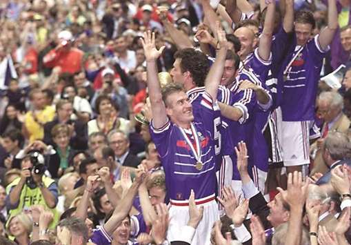 In this July 12, 1998, picture, French player Didier Deschamps and teammates celebrate their World Cup win at the Stade de France. (AFP)