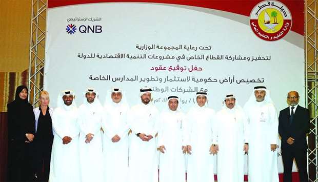Al Hajri and senior Ministry officials are seen with the representatives of the wining companies
