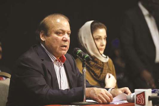 Nawaz Sharif, left, and his daughter Maryam Nawaz, right, attend a UK PMLN Party Workers Convention meeting with supporters in London yesterday.