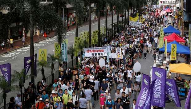 Protesters take part in a march in Hong Kong