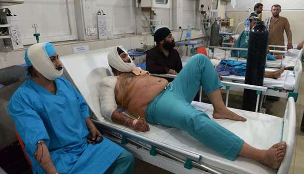 Afghan victims receive treatments at an hospital following a suicide attack in Jalalabad.