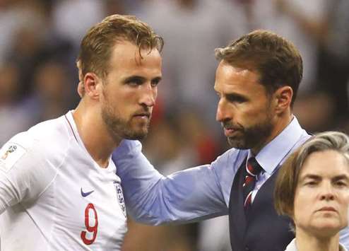 England manager Gareth Southgate (right) consoles captain Harry Kane at the end of the match yesterday. (Reuters)