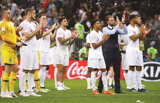 England manager Gareth Southgate and his players applaud fans after the World Cup semi-final loss to Croatia at Luzhniki Stadium in Moscow on Wednesday. (Reuters)