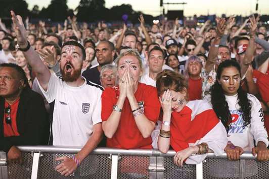 England supporters react at an outdoor screening of the World Cup semi-final in Hyde Park in London on Wednesday. (AFP)