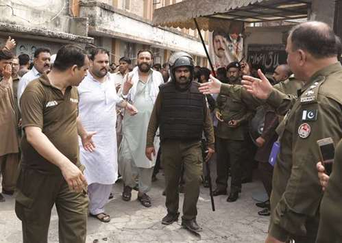 This picture taken on Wednesday shows handcuffed PML-N supporters u2013 who were arrested after holding a rally to obstruct the arrest of Mohammad Safdar, son-in-law of of ousted prime minister Nawaz Sharif u2013 being escorted by police after they were appeared before district court in Rawalpindi.