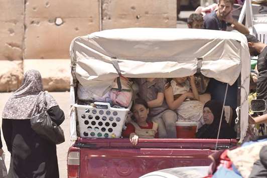 Displaced Syrians from the Daraa province come back to their hometown in Bosra, southwestern Syria.
