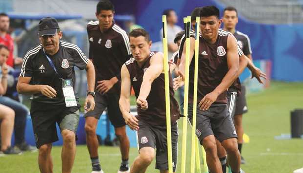 Mexicou2019s Jesus Gallardo and Andres Guardado take part in a training session in Samara, Russia, yesterday. (Reuters)