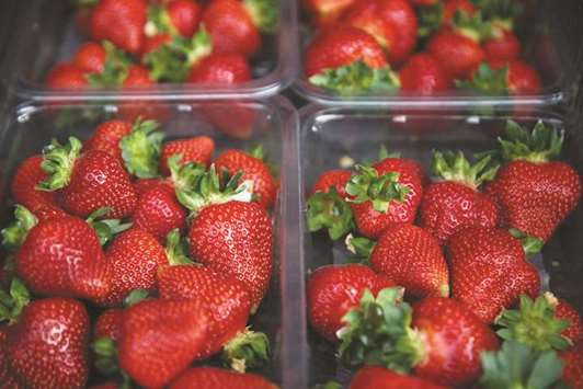 Punnets of strawberries are stacked at BR Brooks & Son farm in Faversham, south east England.