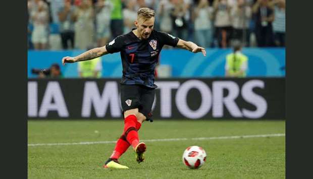 Croatia's Ivan Rakitic scores a penalty during the shootout to give Croatia victory