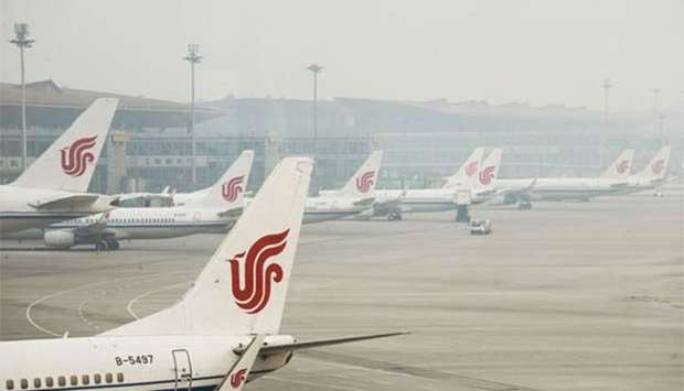 Air China planes are parked at the Beijing Capital International Airport.