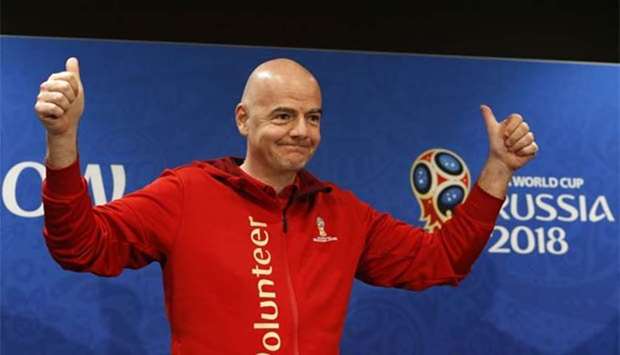 FIFA President Gianni Infantino greets the audience as he attends a news conference at the Luzhniki Stadium in Moscow on Friday.