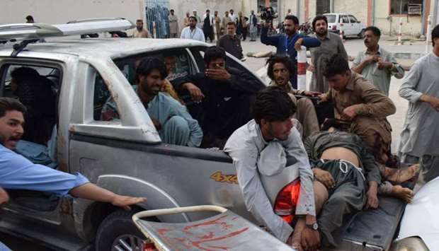 A victim of a bomb blast is brought to a hospital in Quetta following an attack at an election rally.