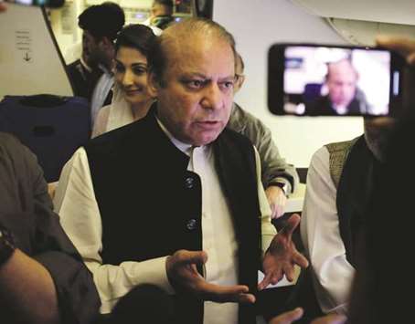Sharif and his daughter Maryam boarding the Lahore-bound flight at Abu Dhabi International Airport.