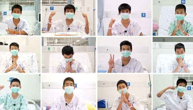 This combo of video grabs compiled from handout footage taken on July 13, 2018 and released by the Ministry of Health, Chiang Rai Prachanukroh Hospital yesterday shows rescued ,Wild Boars, football team members (top row L to R) Adul Sam-on, 14, Ekkarat Wongsukchan, 14, Phipat Photi, 15, Chanin Wiboonrungrueang, 11, (middle row L to R) Pornchai Khamluang, 16, Duangphet Promthep, 13, Peerapat Sompiengjai, 16, Sompong Jaiwong, 13, (bottom row L to R) Mongkol Boonpiem, 13, Prachak Sutham, 14, Nutthawut Thakamsong, 14, and Phanumas Saengdee, 13, recovering at the hospital in Chiang Rai province.