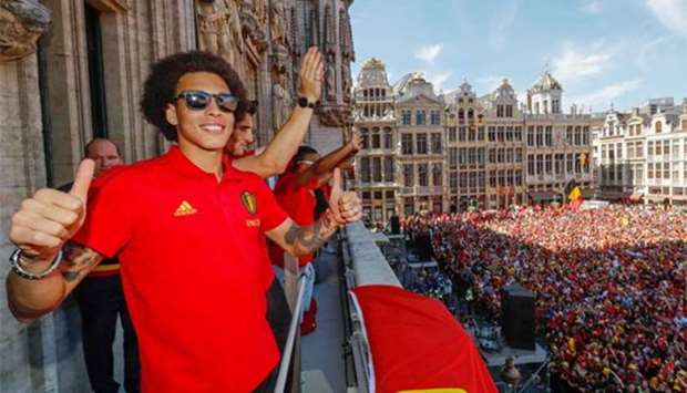 Belgian player Axel Witsel reacts while appearing on the balcony of the city hall at the Brussels' Grand Place on Sunday.