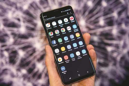 Android app icons sit on the homescreen of the Galaxy S9+ smartphone during a Samsung Electronics Co. u2018Unpackedu2019 launch event in London on February 22, 2018. The Alphabet Inc unit is expected to face a European Union antitrust  fine over Android in the coming days that could top last yearu2019s record u20ac2.4bn ($2.8bn) penalty for shutting out rivals to its shopping search service.
