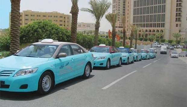 Taxis await passengers in Doha.