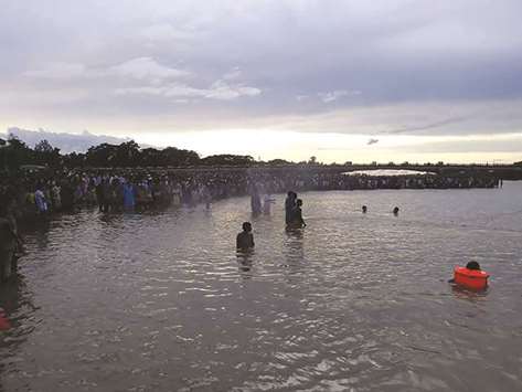 Rescuers search for the bodies of the drowned footballers in Matamuhuri river in Chittagong yesterday.