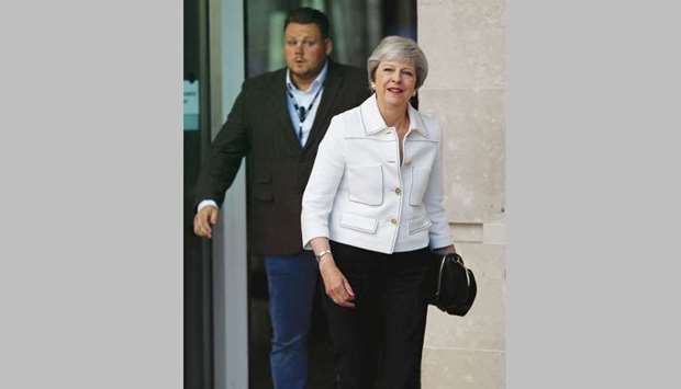 Prime Minister Theresa May leaves the BBC after appearing on the Andrew Marr Show in central London yesterday.