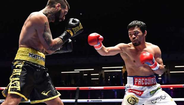 Philippines' Manny Pacquiao (R) fights Argentina's Lucas Matthysse during their world welterweight boxing championship bout at Axiata Arena in Kuala Lumpur