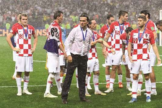 Croatiau2019s coach Zlatko Dalic (centre) and players are dejected after the World Cup final defeat. (AFP)