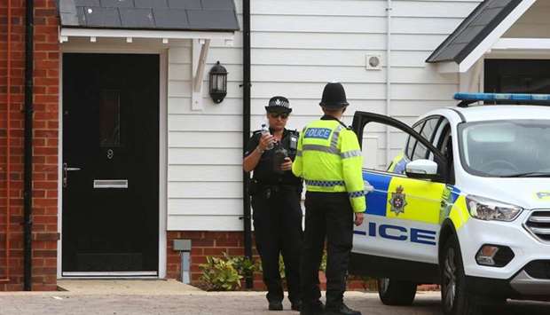 A police officer stands guard outside Charlie Rowley's house in Amesbury, southern England, on fourth of this month.